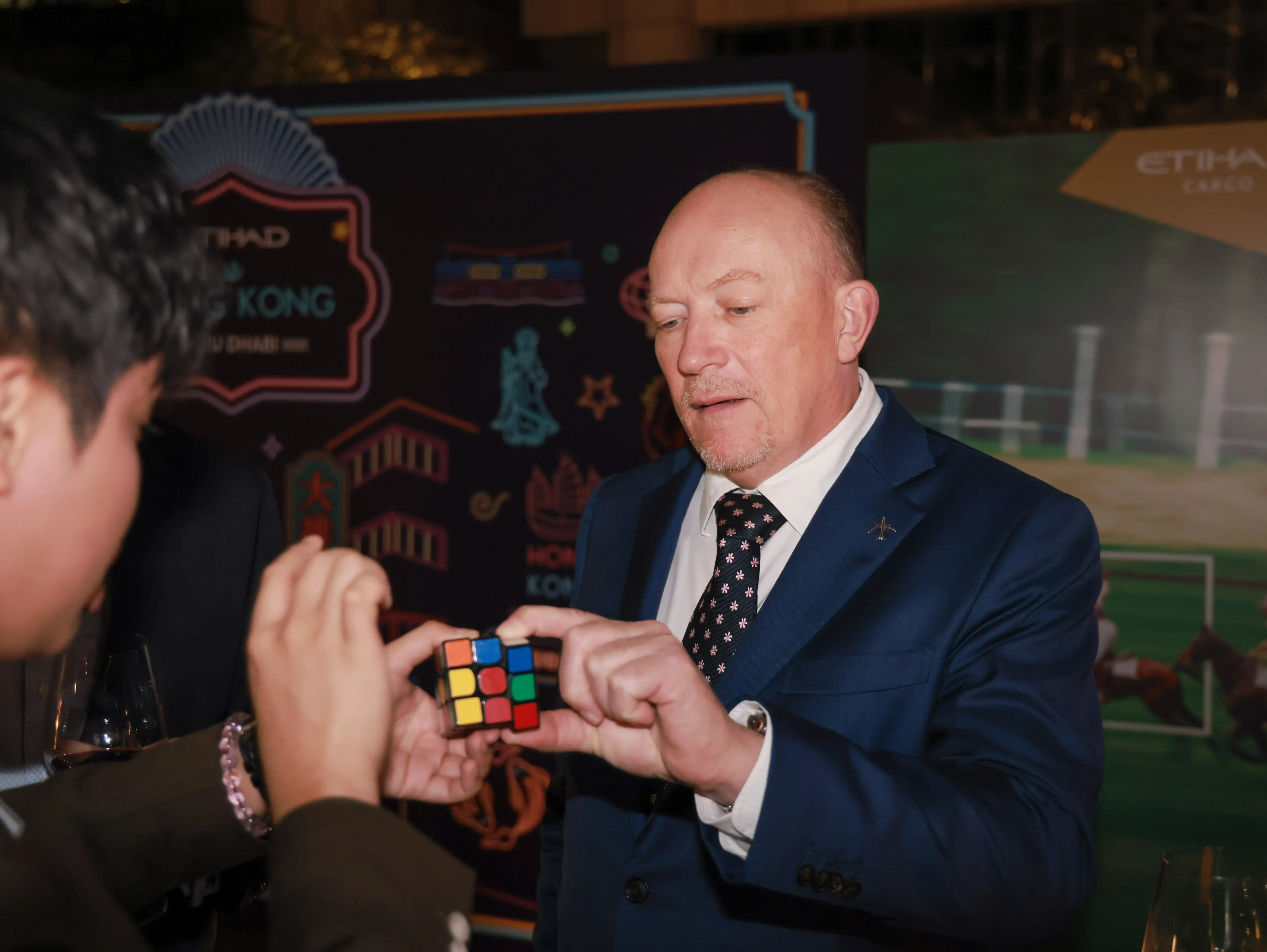 Magician engaging a crowd at a networking event