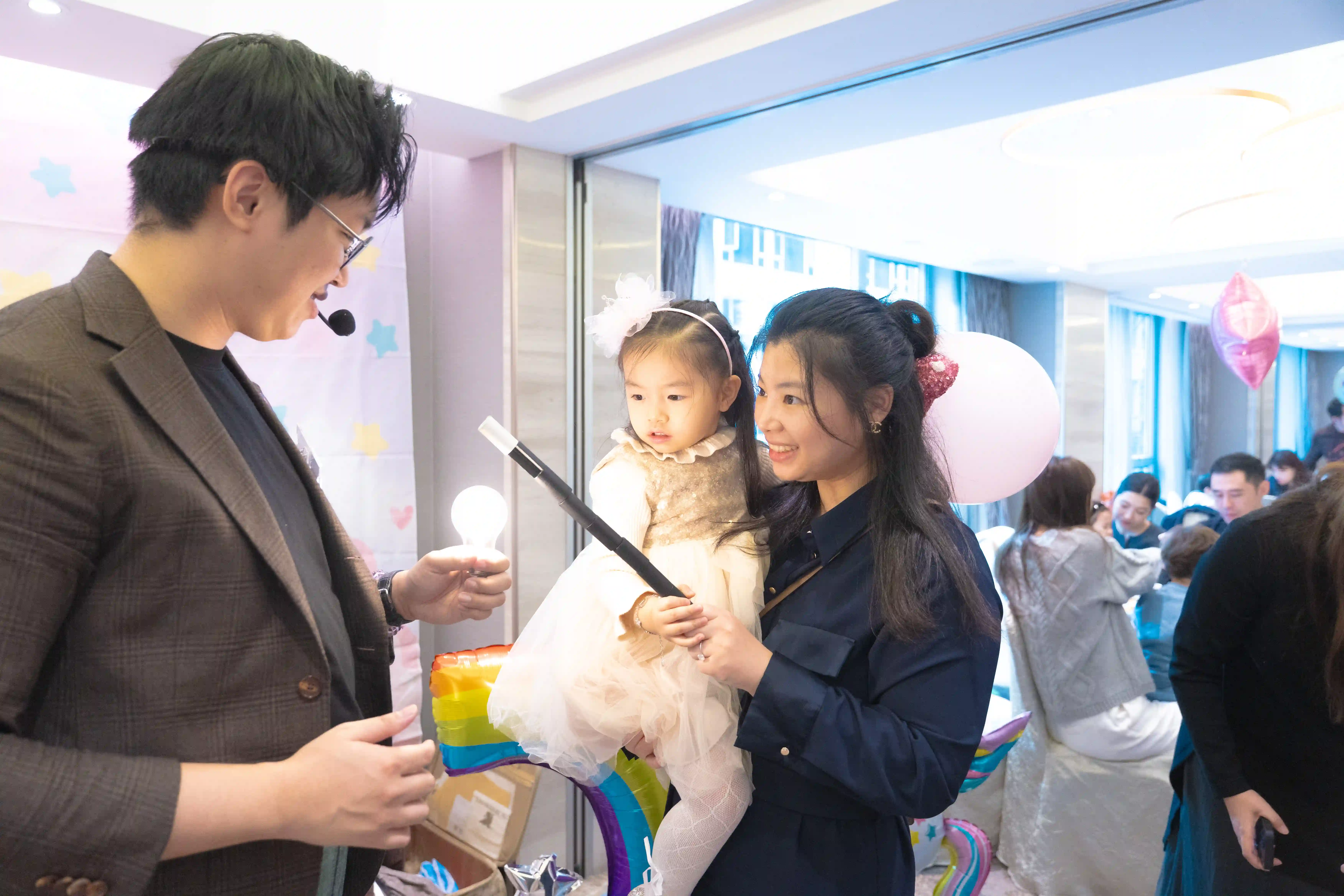 Gentle magician interacting with a young child, showing a friendly approach